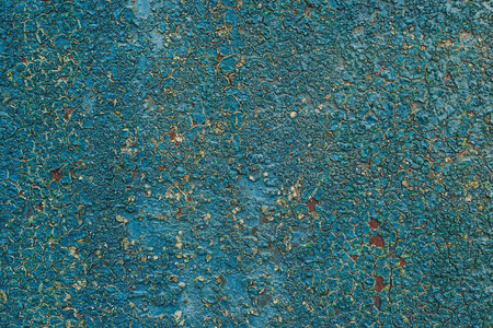 Old rusty metal background with a blue paint flaking texture.の写真素材