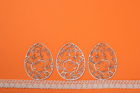 Easter card, decorated easter eggs isolated on the orange background.