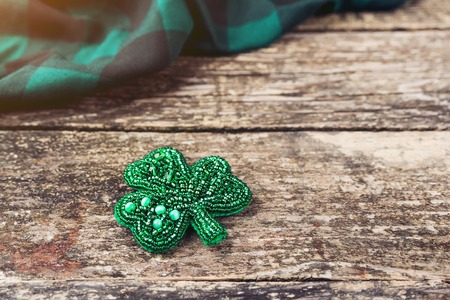 Beautiful brooch in the form of clover. Handmade beadwork jewerly.の写真素材