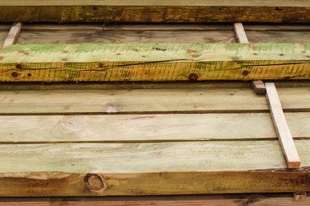 stacked wooden beams with protective varnish, close up