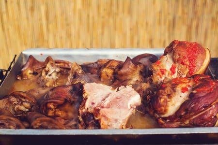 Food street. Pork knees on a tray outdoors. Czech market in Prague. Festival of street foodの写真素材