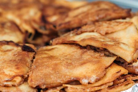 Fried tortillas, close up. Street food. Fried bread at street market. Fast food.の写真素材