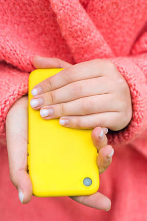 Nails need in correction. Nails care. Time for correction gel polish. Female hands and overgrown gel nails, close up. Hand care concept. Woman hands during quarantine.の写真素材