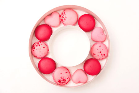 Macaroons cookies in box on white table. French cookies in gift box. Sweet macarons in gift box....