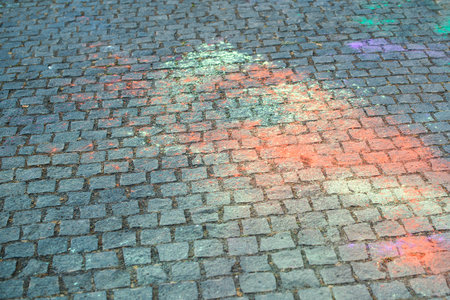 Colorful Holi powder background, top view. Background of colorful Holi powder on the ground. Copy...
