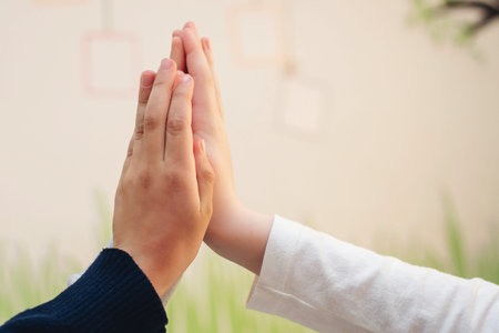 Two boys giving high five. High five concept for success, teamwork, congratulating, celebration....