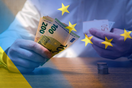 Financial and economic background. Europe helps Ukraine with money. Abstract Europe Ukraine politics relationship concept.の写真素材