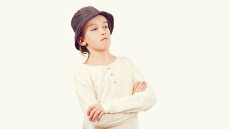 Positive teen boy crossing arms. Portrait of young thoughtful school boy. Serious boy thinking...