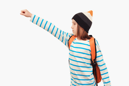 School boy with backpack. Education concept. Back to school. Boy in casual clothes with schoolbag is ready for studying. Student goes forward.の写真素材