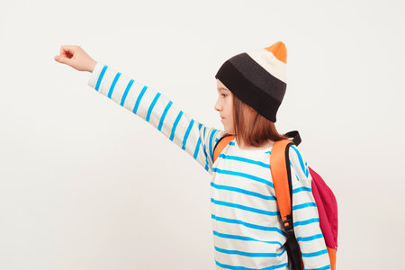 School boy with backpack. Education concept. Back to school. Boy in casual clothes with schoolbag is ready for studying. Student goes forward.の写真素材