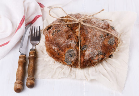 Crusty bread on a white wooden background