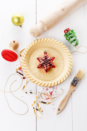 Charismas baking concept. Tart base and utensils over white wooden background. Top viewの写真素材