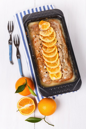 Glazed orange loaf with orange slicesの写真素材