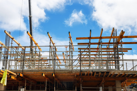 Fragment of a new building framework and reinforcement on a construction siteの写真素材