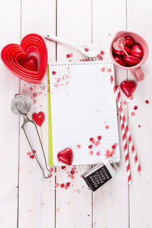 Valentine day baking concept with cookie cutters, chocolate hearts and kitchen tool. Top view, Copy spaceの写真素材
