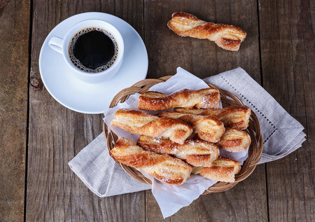Fresh baked traditional Italian dessert sfogliatine and coffee on rustic wooden backgroundの写真素材