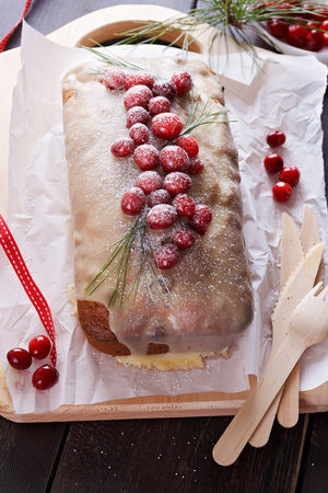 Pound cake with fresh cranberries over rustic wooden backgroundの写真素材