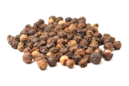 A handful of black pepper isolated on white background
