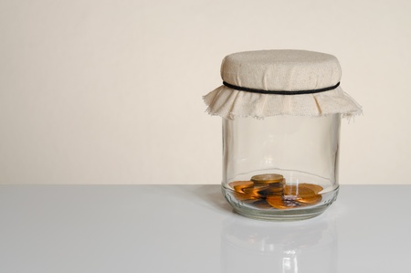 Savings - coins in a jar with copy spaceの写真素材