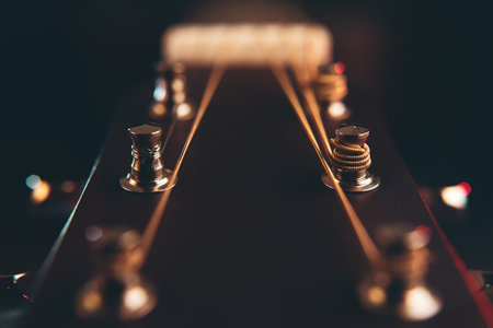 Guitar on black background with shallow depht of fieldの写真素材
