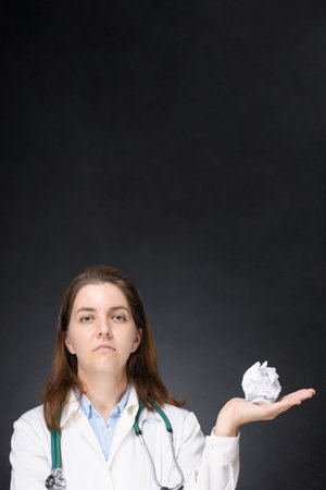 Doctor with crumpled paper ballの写真素材