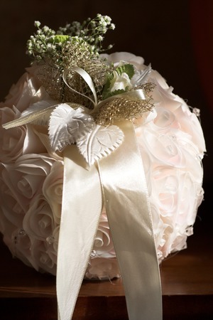 Round purse made of white ribbonsの写真素材