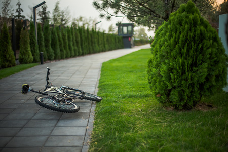 Bike lies on the road from tiles.の写真素材