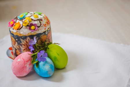 Easter cake with eggs and a flower vinca, periwinkle. Easter background. Self-baked Easter cake. Orthodox Traditions and Holidaysの写真素材