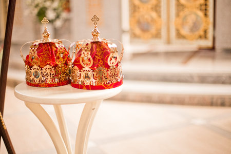 Two red Wedding Ceremonial sacrament Crown in the temple near the altar. sacrament of wedding in the...