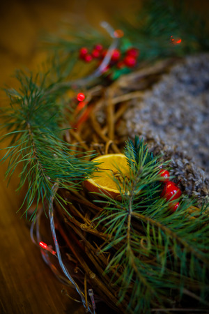 nest of the vine with the decor. Christmas wreath. Berries and candied fruits on the wreath.の写真素材