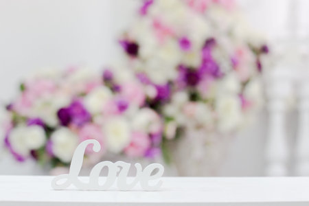 inscription love on a background of flowers. Free space. Copy space.の写真素材