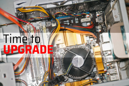 Text TIME TO UPGRADE . top view of computer parts with harddisk, ram, CPU, graphics card, solid...