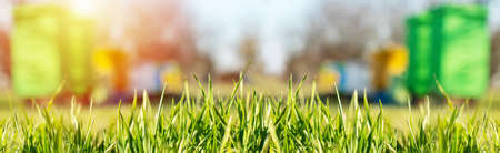 Background of hives against green grass. Beehives with honey bees. bees come back from honey collection and fly into beehives entrance.の写真素材