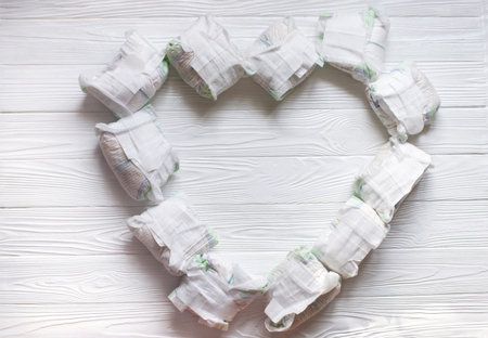 Diapers waste - dirty diapers of baby. Disposing of used baby nappies. heart of the used diapers on...