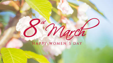 Text 8 march Happy womans day Spring border or background art with pink blossom. Pink cherry blossoms against the blue sky. Abstract blurred background. Springtimeの写真素材