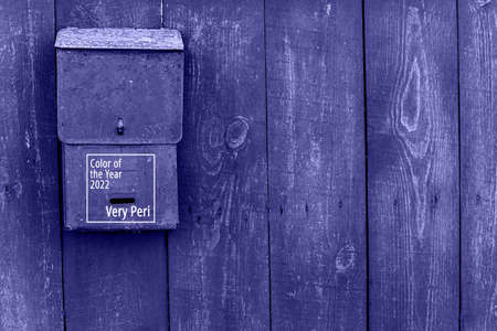 Text Color of the Year 2022. Very peri. For letters and newspapers. Translation of the Russian text. Mail box on the wooden fence redの写真素材