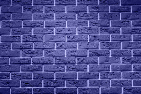light gray brick wall, creative back-phonon closeup