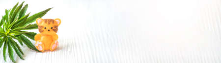 tiger is symbol of 2022 on Chinese New Year calendar near cannabis leaf. Legalization of medical marijuana in the worldの写真素材