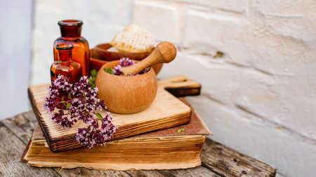 Oregano, Collect valuable flowers Origanum vulgare from moment of flowering, and start drying. Decoction of sweet marjoram and infusion in clear bottle. alternative medicine. herbal conceptの写真素材