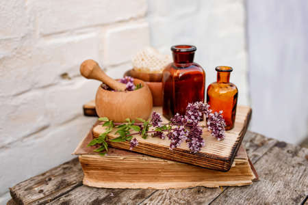 Oregano, Collect valuable flowers Origanum vulgare from moment of flowering, and start drying. Decoction of sweet marjoram and infusion in clear bottle. alternative medicine. herbal conceptの写真素材