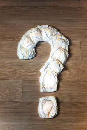 A question from diapers. Question mark of hygiene items. The cost of buying disposable underwear for...
