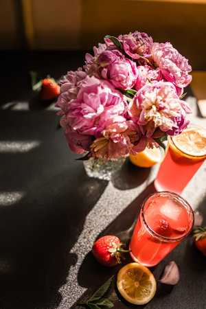 sparkling strawberry margarita, garnished with slice of fresh fruit and served in a crystal clear glassの写真素材
