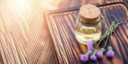 Canadian thistle, lettuce from hell thistle, California thistle, corn thistle, cursed thistle, field thistle, green thistleapothecary bottles with tincture and essential oils for beauty salons and alternative medicineの写真素材