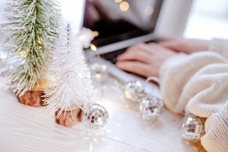 Online shopping for Christmas. Background with hands on the keyboard. Christmas desktop dÃ©corの写真素材