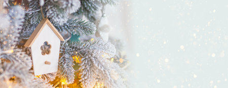 Christmas background. Christmas tree toy birdhouse on the New year tree. Copy spaceの写真素材
