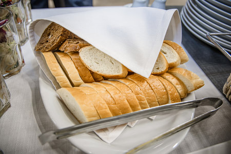Different types of bread on a buffet table at a wedding reception.の写真素材