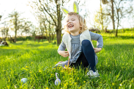 rejoicing in the feast of Easter and waiting to search for Easter eggs in the park among the grass....