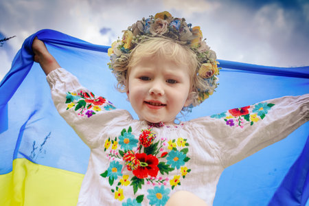 Ukrainian flag blue and yellow flag of Ukraine in hands of happy girl Ukrainian. Independence Day. Flag Day. Constitution dayの写真素材