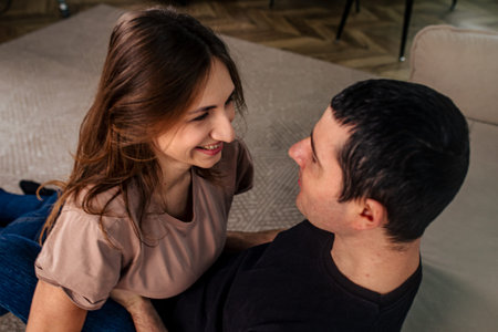 Couple sharing a romantic moment on Valentines Day in cozy indoor setting