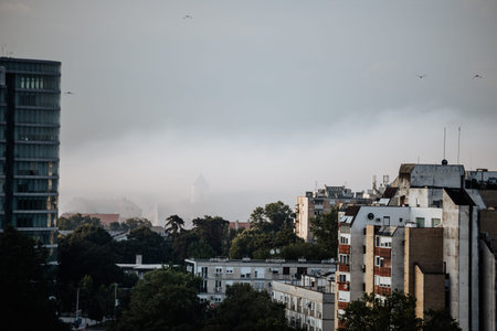 Chemical fog drifting over cityscape in Osijek